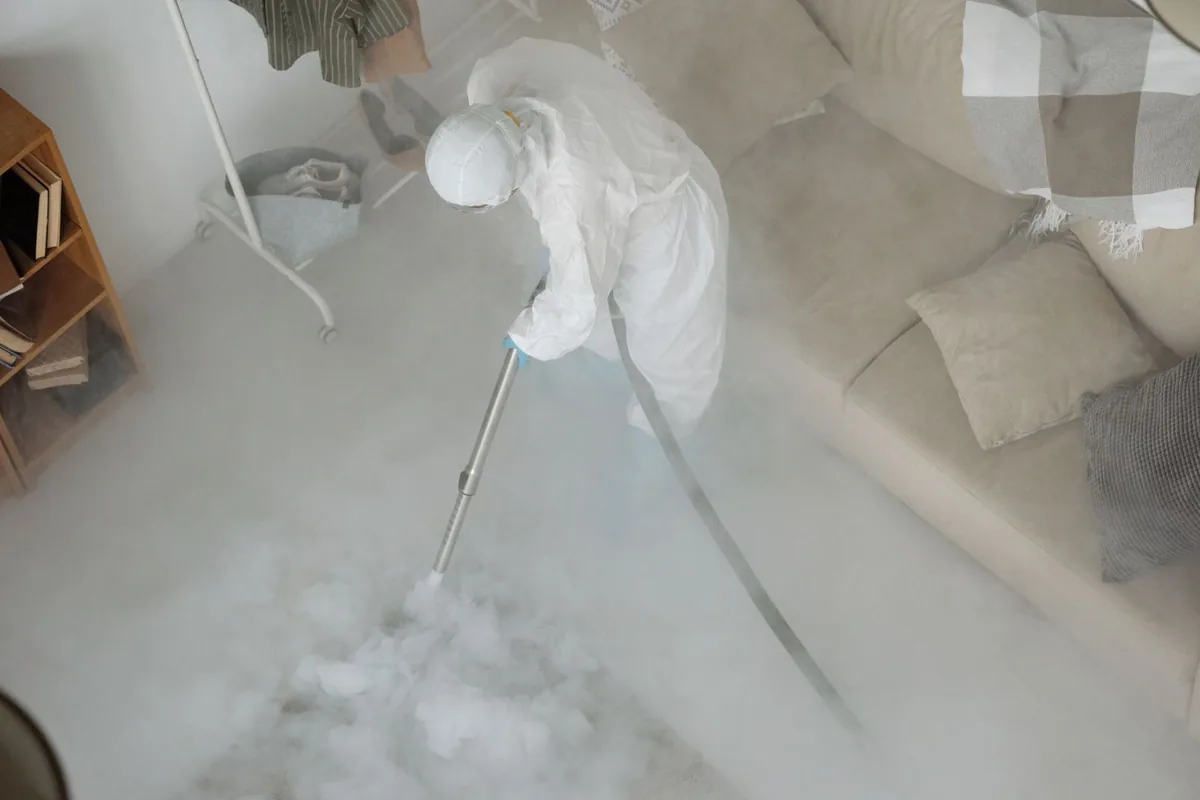 Biohazard cleanup technician in protective equipment, Carnegie, PA